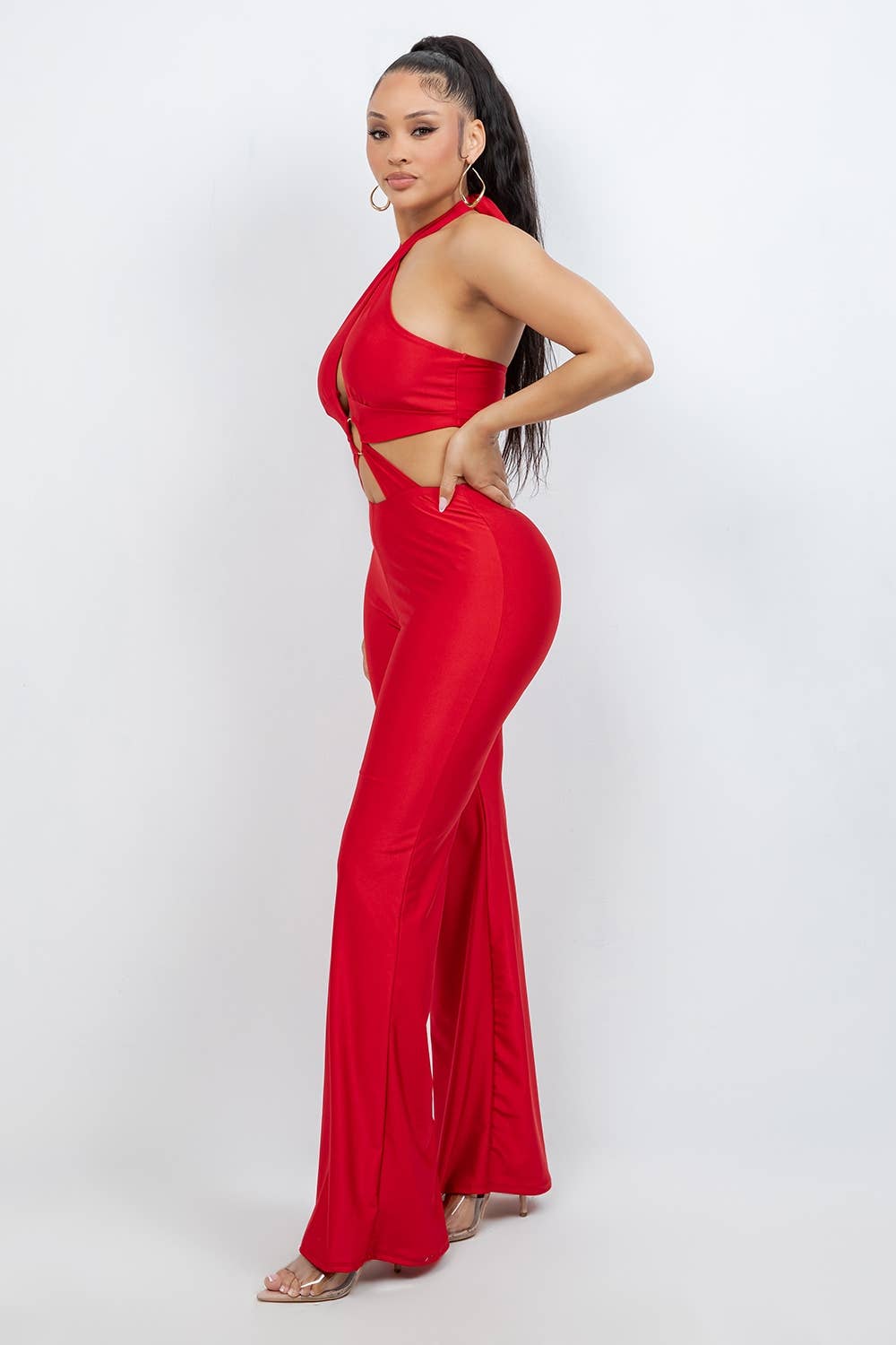 Women’s red flare-leg halter jumpsuit with slim curve-hugging fit