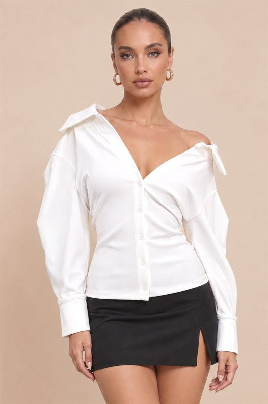 Main Character Puff Sleeve Top front view, white off-shoulder collared button-front top with puff sleeves and fitted waist, styled with a black mini skirt