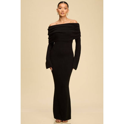 Model wearing the Noir Off-Shoulder Knit Sweater Dress in black