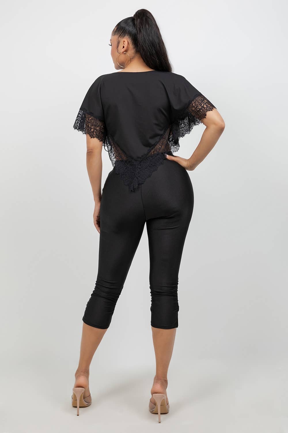 Back view of black high-waisted capri leggings from She Rare Boutique