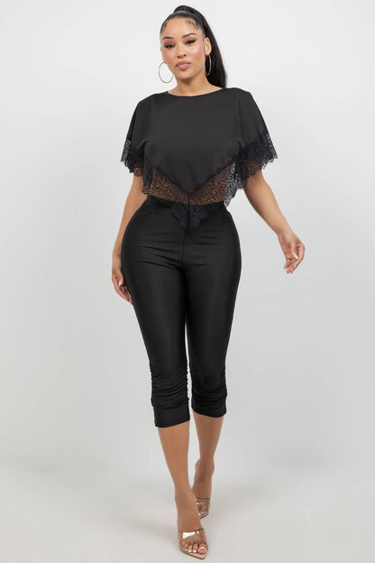 Close-up of shirred hem detail on black stretch capri leggings