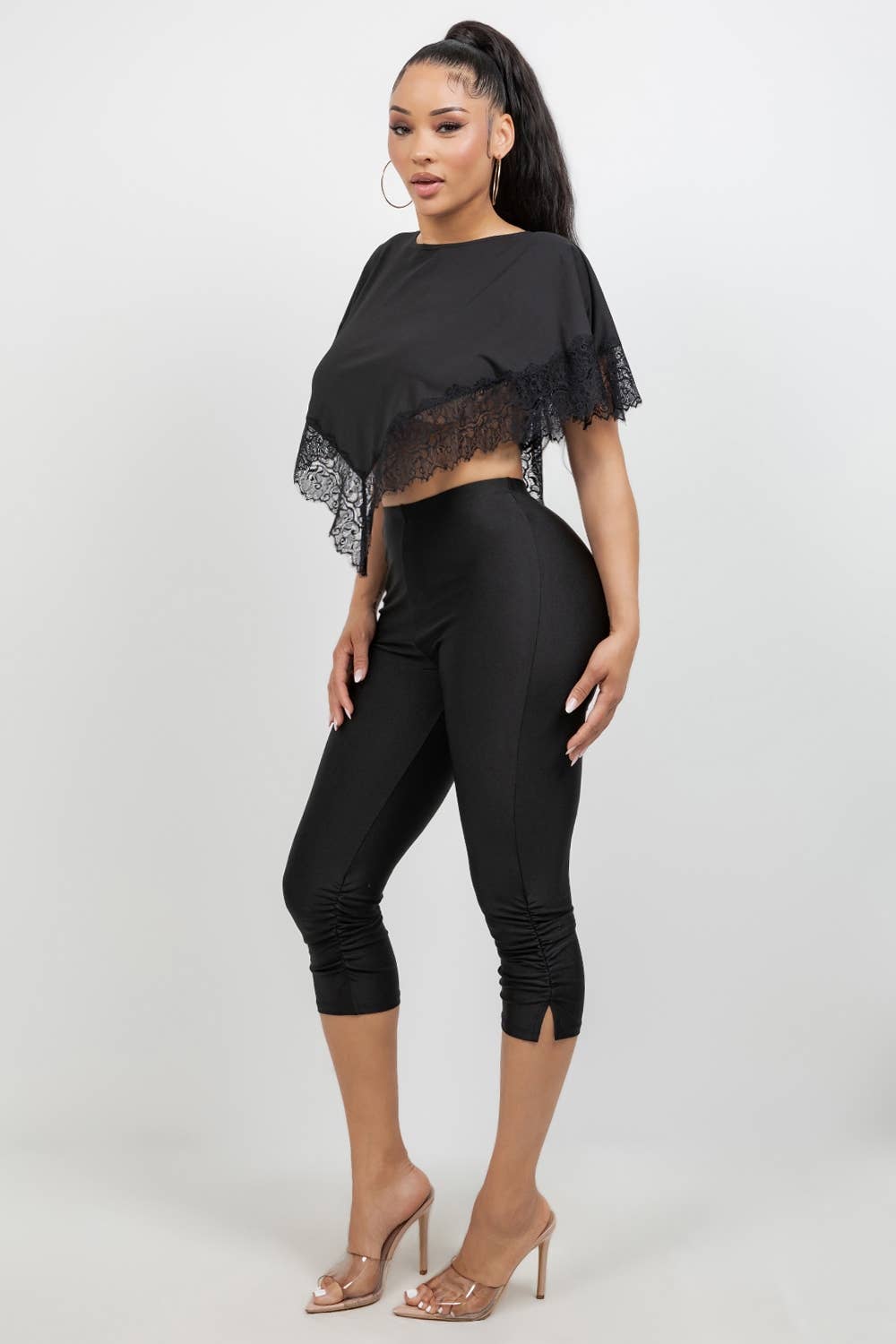 Side view of black fitted capri leggings with smooth scuba fabric