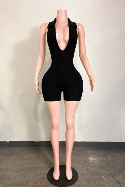 Worth the Wait black rib knit romper with deep V neckline from She Rare Boutique